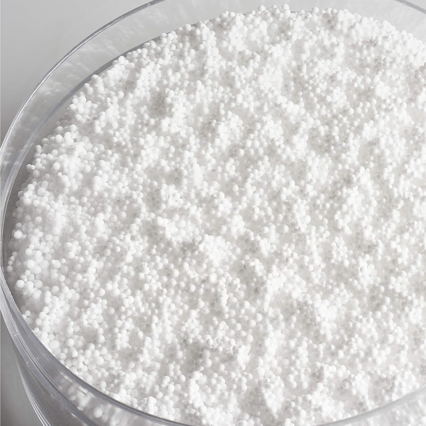 Close-up of Medela nursing pillow showing Quiet Micro-Pearl filling for soft support.