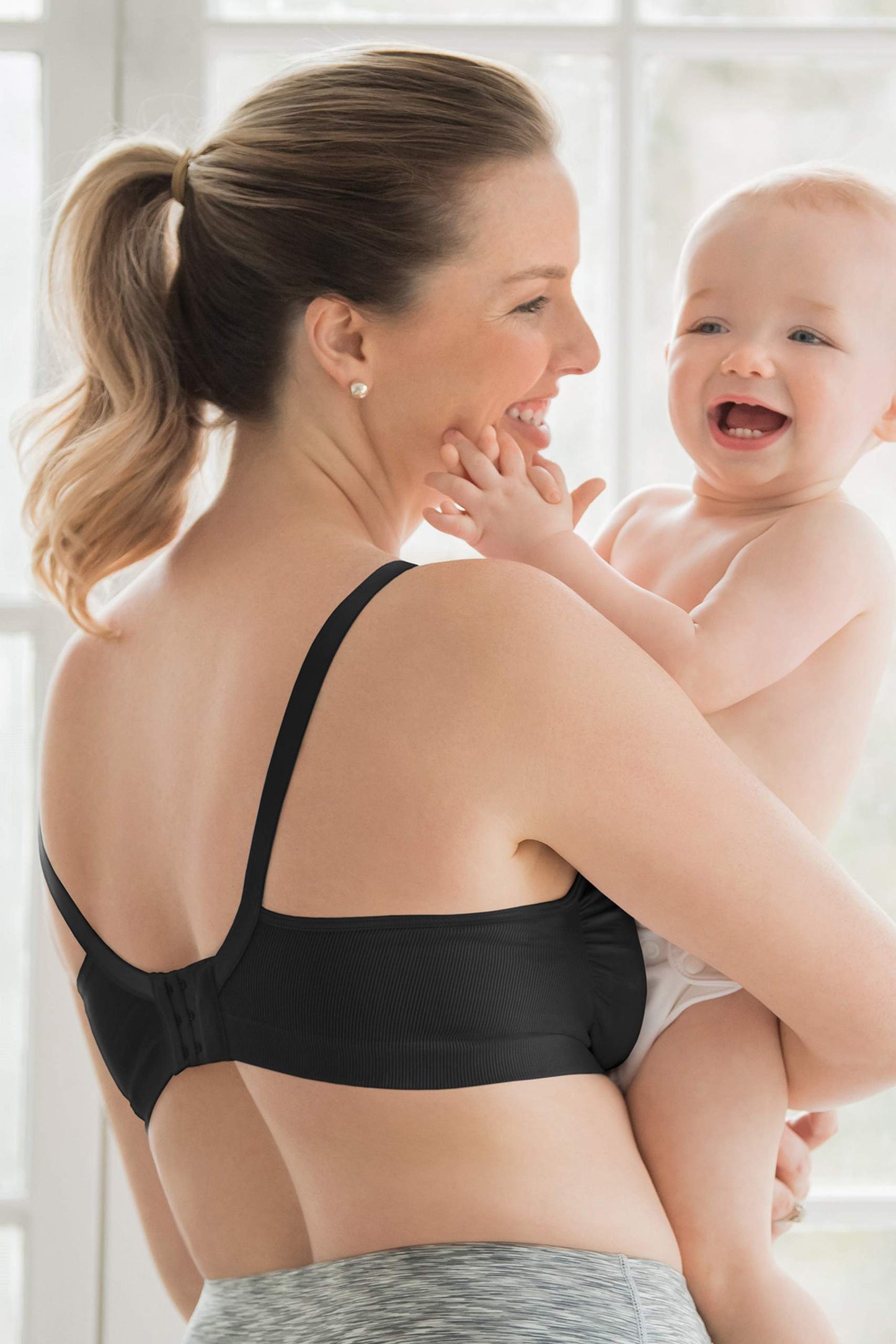 Back view of black Medela nursing bra highlighting supportive and seamless design.