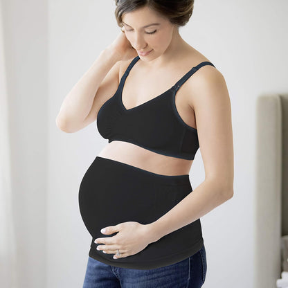 Mom wearing Medela black supportive belly band, showing comfortable and flexible fit.