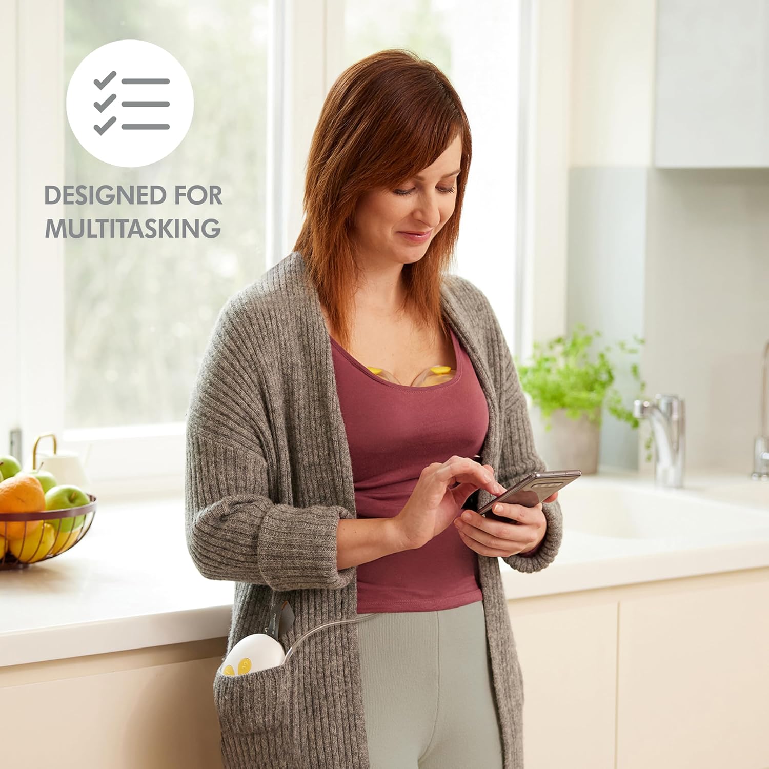 Mother Using Medela Duo Hands-free Breast Pump While Working