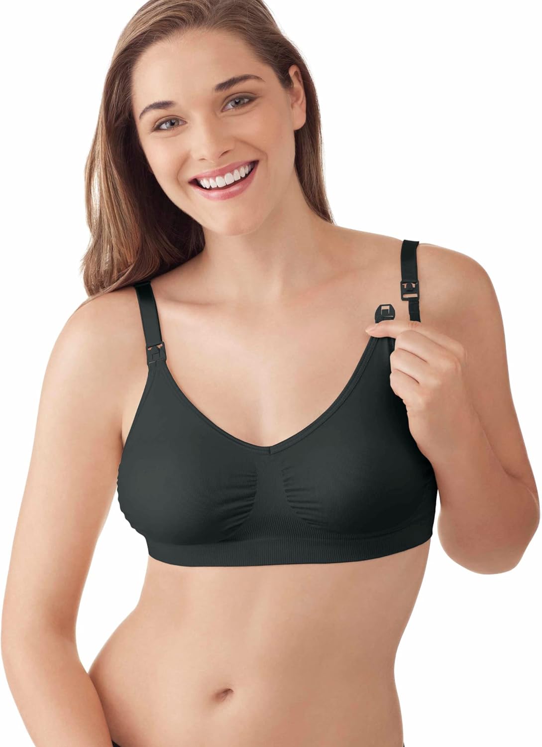 Woman wearing Medela nursing bra demonstrating easy-access clip feature.