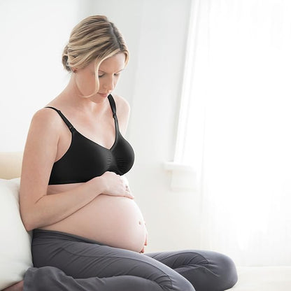 Woman wearing black Medela Comfy Bra, side angle showing front design.